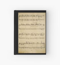 Cuaderno de tapa dura fragmento con notas musicales