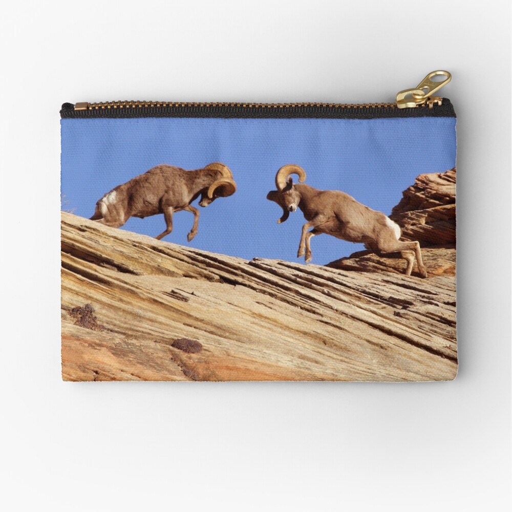 Bighorns Battling in Red Rock Country Zipper Pouch