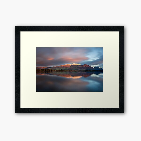 Sunset over the white summit of Skiddaw in the English Lake District Framed Art Print