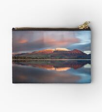 Sunset over the white summit of Skiddaw in the English Lake District Zipper Pouch
