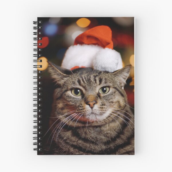 Item preview, Cat Wearing Santa Hat in front of a Christmas Tree designed and sold by Leslie Banks.