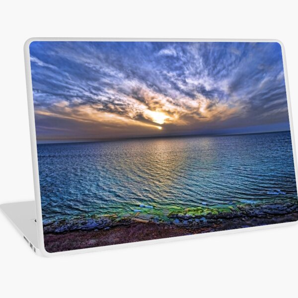 sunset at the cliff beach Laptop Skin
