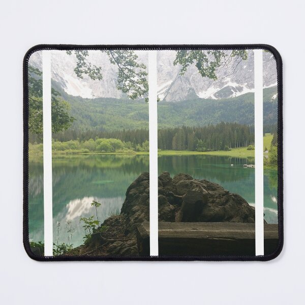 Item preview, A static shot from the shore of Fusine lake in the Julian Alps with snowy mountains in background and a bench. Beautiful nature in a spring cloudy day; no people around. Italy designed and sold by Maurizio Fabbroni.