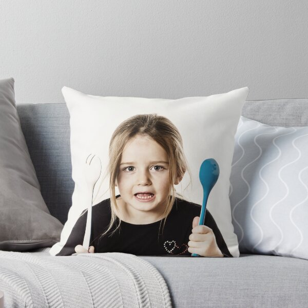 Item preview, Preschooler girl playing with spoons for salad, isolated on white background designed and sold by Alexander Sorokopud.
