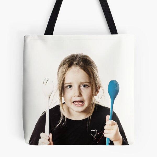 Item preview, Preschooler girl playing with spoons for salad, isolated on white background designed and sold by Alexander Sorokopud.