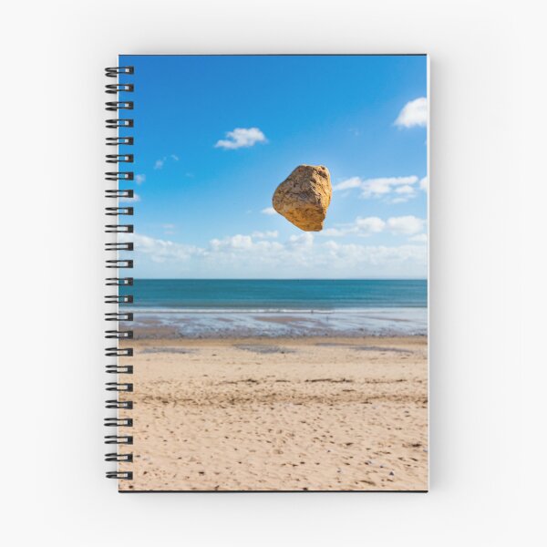 Item preview, In the air - levitating sandstone rock defying gravity at the beach designed and sold by Katharine Harper.