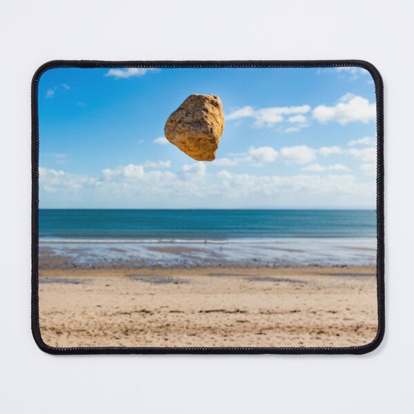 Item preview, In the air - levitating sandstone rock defying gravity at the beach designed and sold by Katharine Harper.