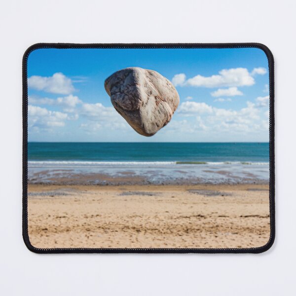 Item preview, In the air - levitating rock defying gravity at the beach designed and sold by Katharine Harper.