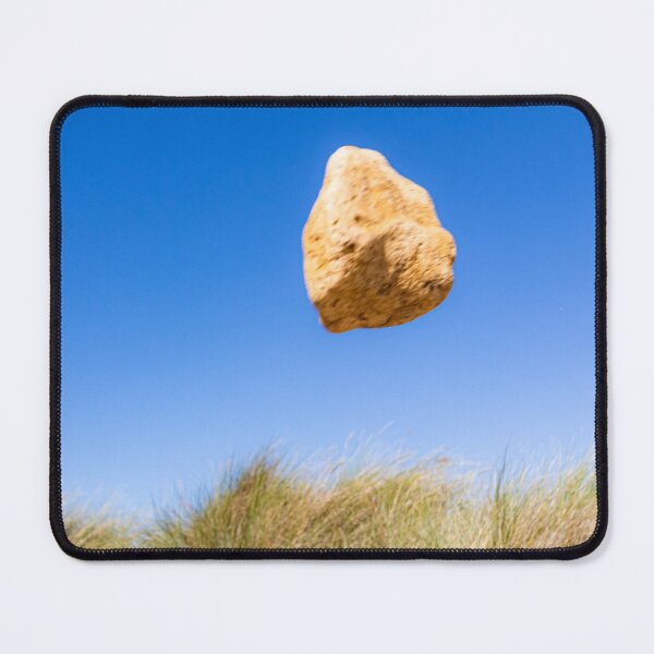 Item preview, In the air - levitating sandstone rock defying gravity on the sand dunes designed and sold by Katharine Harper.