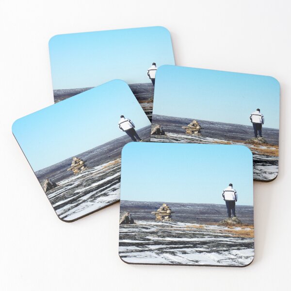 Item preview, Lonely man on the top of a mountain in Kuujjuaq, standing by an inuksuk in Kuujjuaq designed and sold by celinebisson.