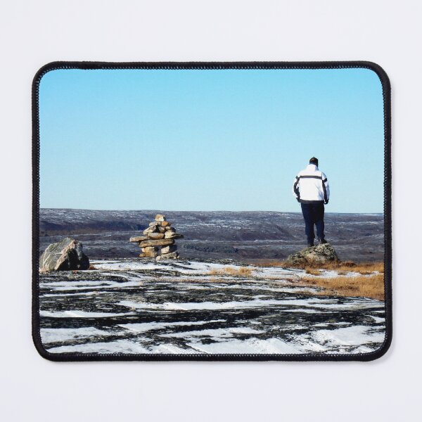 Item preview, Lonely man on the top of a mountain in Kuujjuaq, standing by an inuksuk in Kuujjuaq designed and sold by celinebisson.