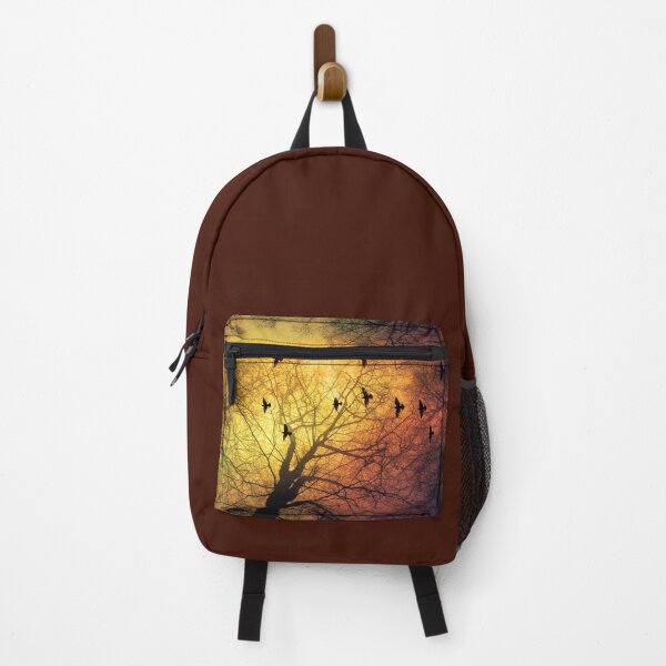 Item preview, inVasion - tree silhouettes and flock of birds against a dramatic sky designed and sold by Dyrk Wyst Redbubble Shop.
