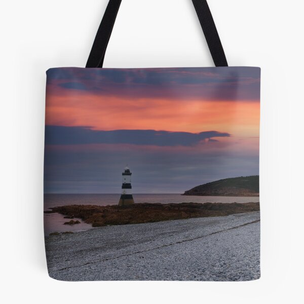 Item preview, Sunrise At The Trwyn Du Lighthouse designed and sold by rawshutterbug.