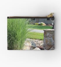Possibly the best bush ever next to an outdoor reading lamp Studio Pouch