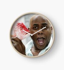Ainsley Harriott Holding a Fish Clock