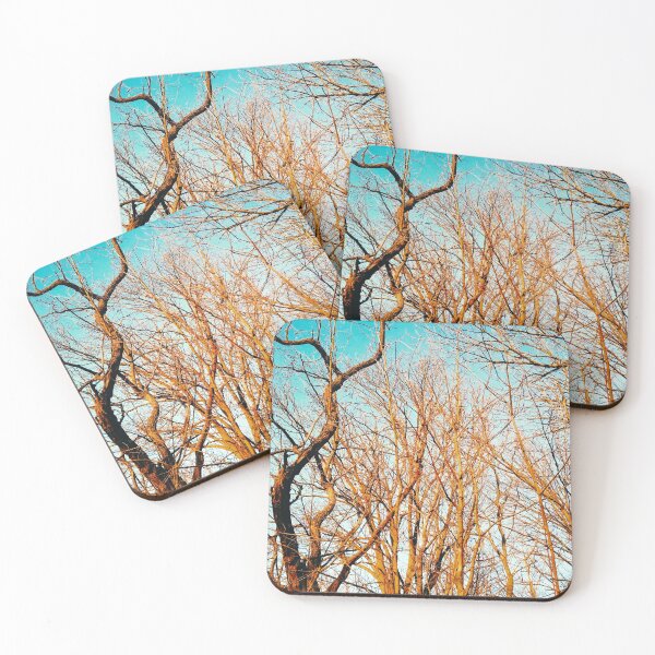 Item preview, Bare winter trees twisting and bending against the background of the blue cloudless sky  designed and sold by helenkaiy.