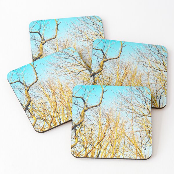 Item preview, Bare winter trees twisting and bending against the background of blue cloudless sky designed and sold by helenkaiy.