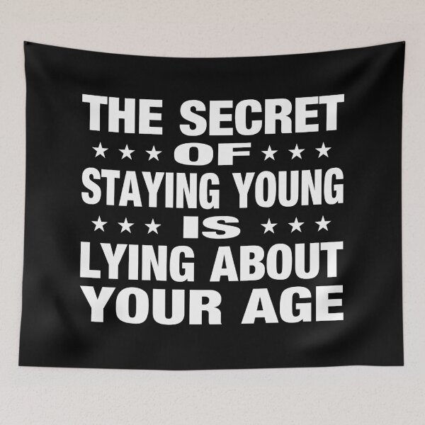 Item preview, The Secret Of Staying Young Is Lying About Your Age Typography Birthday or Age Quotes or Phrase in Normal Style - Funny designed and sold by Vasabi88.