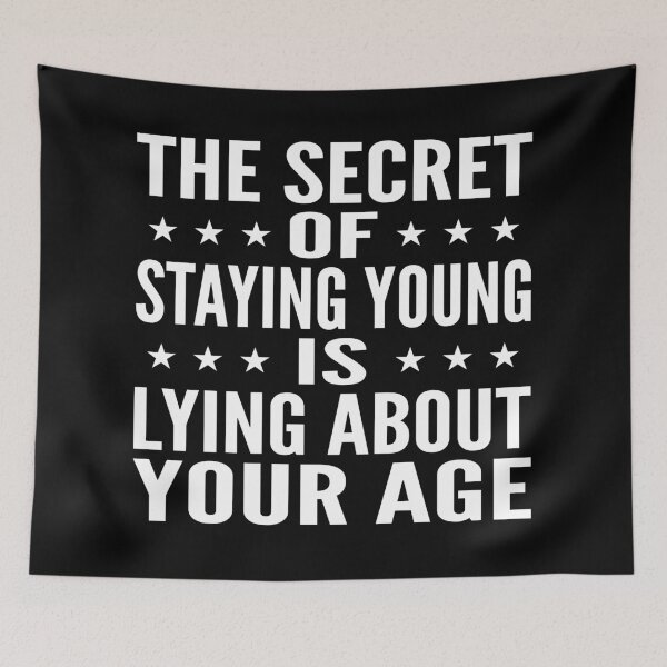 Item preview, The Secret Of Staying Young Is Lying About Your Age Typography Birthday or Age Quotes or Phrase in General Style - Funny designed and sold by Vasabi88.
