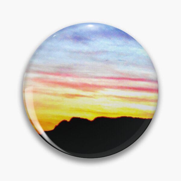 Item preview, Colorful sunset with a vibrant blue sky against a mix of yellowish, orangish and reddish clouds with a hill in the distance designed and sold by Alahyane Said.