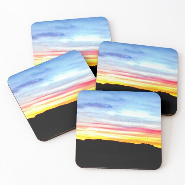 Item preview, Colorful sunset with a vibrant blue sky against a mix of yellowish, orangish and reddish clouds with a hill in the distance designed and sold by Alahyane Said.