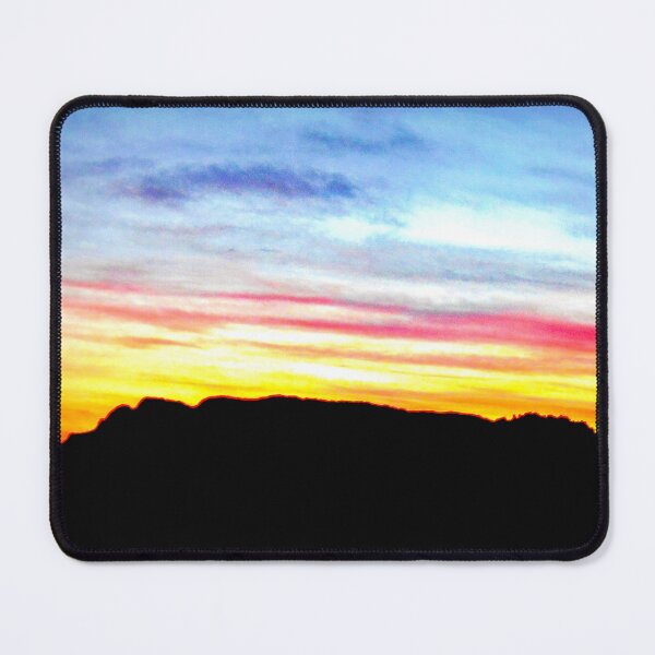 Item preview, Colorful sunset with a vibrant blue sky against a mix of yellowish, orangish and reddish clouds with a hill in the distance designed and sold by Alahyane Said.