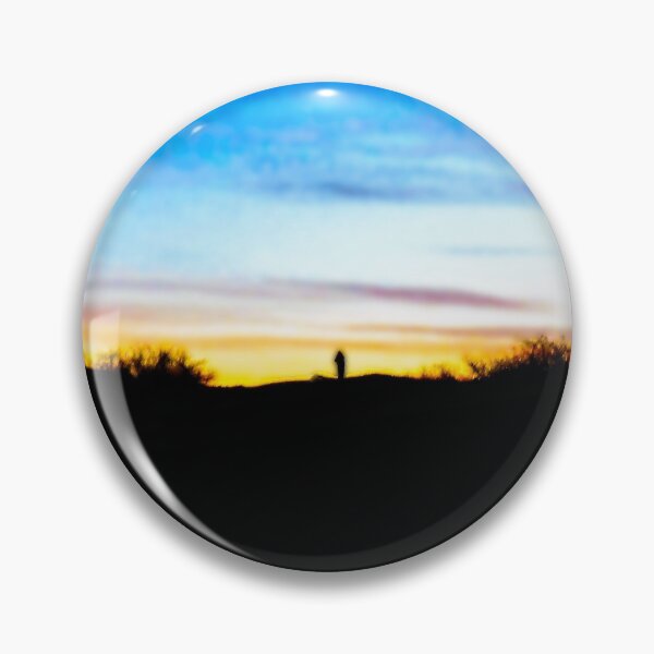 Item preview, Colorful sunset with a vivid blue sky against magenta, orangish and yellowish clouds with a villager walking back home in the distance designed and sold by Alahyane Said.