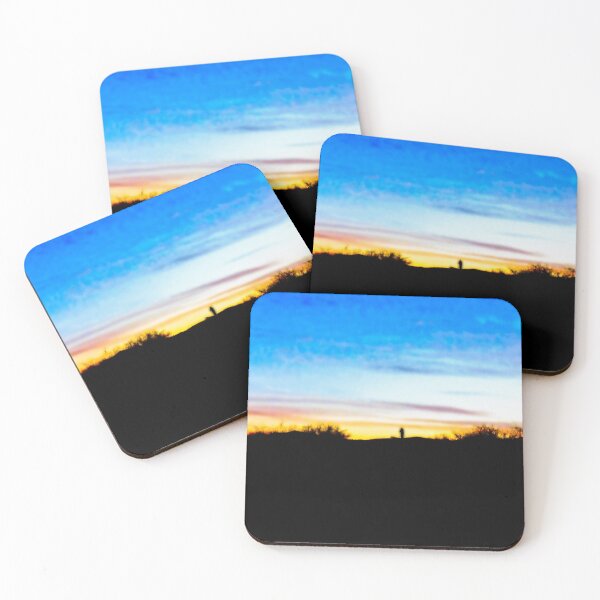 Item preview, Colorful sunset with a vivid blue sky against magenta, orangish and yellowish clouds with a villager walking back home in the distance designed and sold by Alahyane Said.
