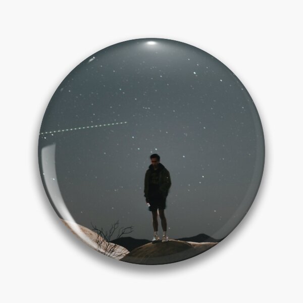 Item preview, man in black jacket standing on brown rock during night time designed and sold by buucake.