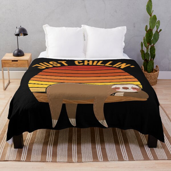 Item preview, Just chillin (Just chilling). Sloth chilling in a tree in front of a retro vintage sunset. Vintage, dark yellow text designed and sold by JellyBeenzz.