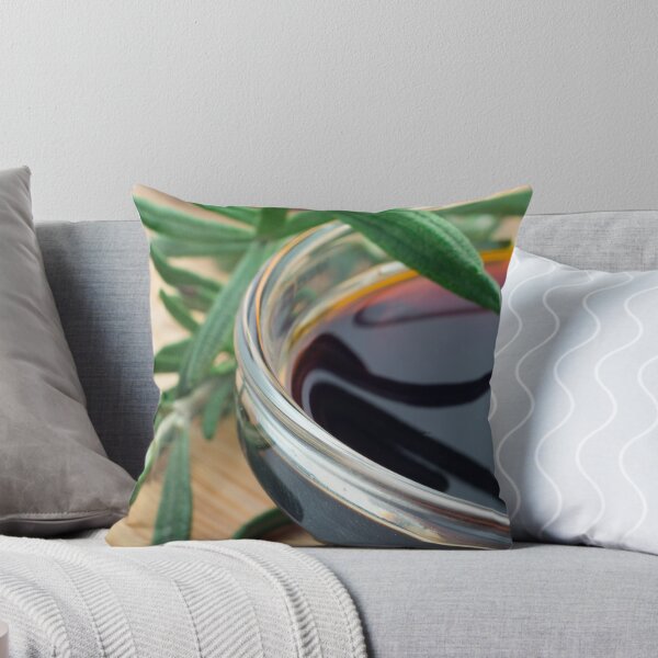 Item preview, Glass cup with soy sauce and rosemary leaves closeup designed and sold by vladromensky.
