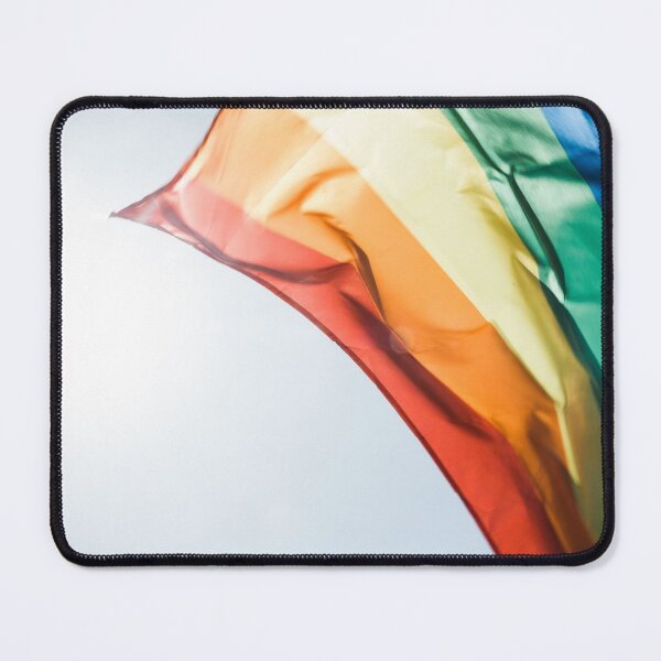 Item preview, Rainbow pride flag flying in the daytime breeze. designed and sold by Mustansar Ali.