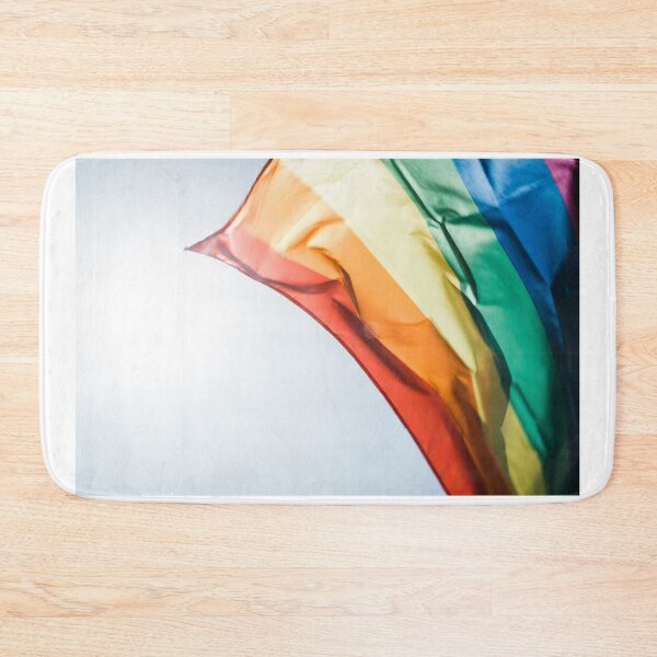 Item preview, Rainbow pride flag flying in the daytime breeze. designed and sold by Mustansar Ali.