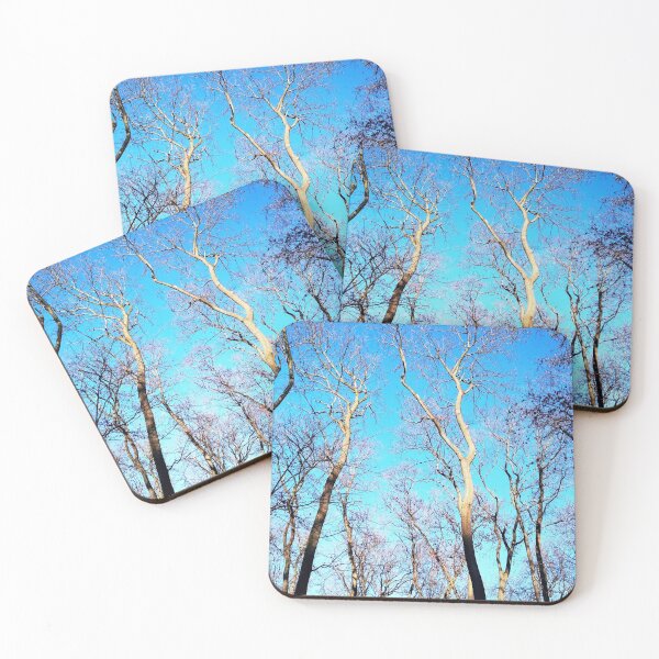 Item preview, Bare winter trees against the background of the blue cloudless sky  designed and sold by helenkaiy.