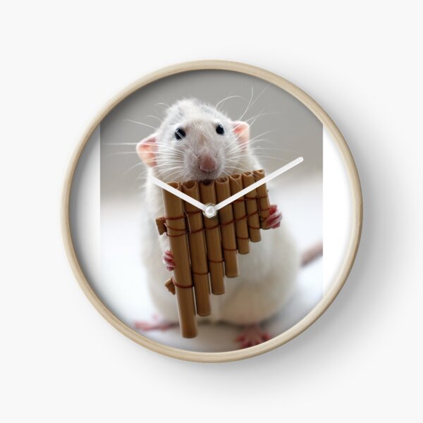 Playing the panflute. Clock