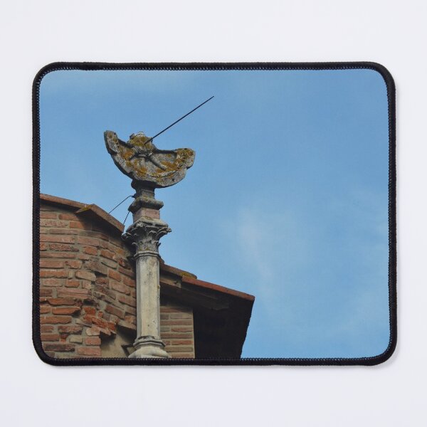 Item preview, An old stone sundial on a roof seen against a blue sky. designed and sold by EAnneH.