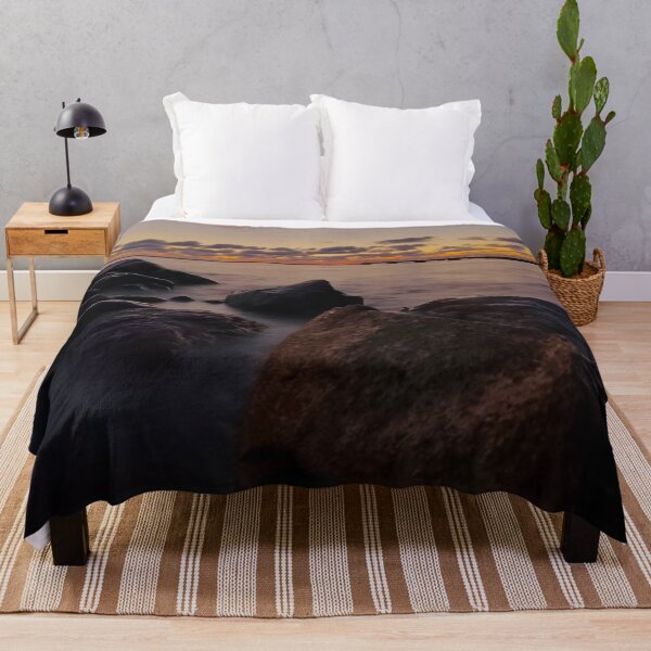 Item preview, Rocks in the sea during sunset designed and sold by HenrikGPhoto.