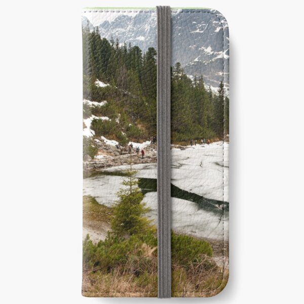 Tourists trek around Morskie Oko Lake iPhone Wallet