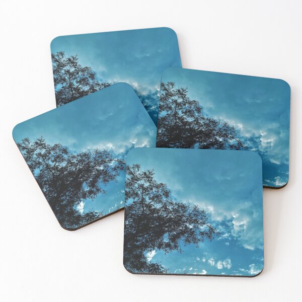 Item preview, A Blue Dreamy Sky with Tree Branches & Scattered Cotton Candy Clouds - Photography designed and sold by By Roqia.