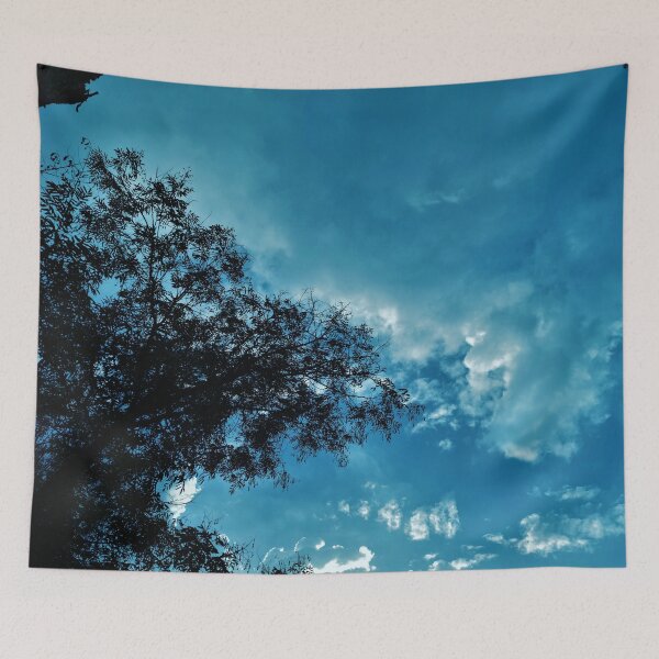 Item preview, A Blue Dreamy Sky with Tree Branches & Scattered Cotton Candy Clouds - Photography designed and sold by By Roqia.