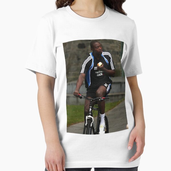 Item preview, Shola Eating An Apple On A Bike T-Shirt designed and sold by Toon T-Shirts.