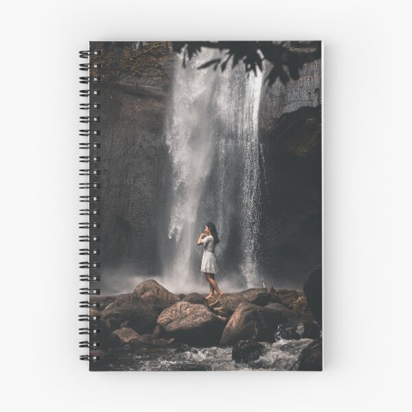 Item preview, man in blue denim jacket standing on brown rock near waterfalls during daytime designed and sold by buucake.