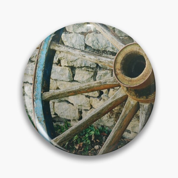 Item preview, Wooden wagon wheel on stone wall  designed and sold by CarolinaReina.