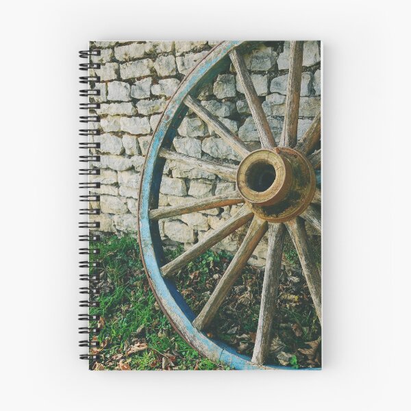 Item preview, Wooden wagon wheel on stone wall  designed and sold by CarolinaReina.
