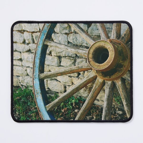 Item preview, Wooden wagon wheel on stone wall  designed and sold by CarolinaReina.