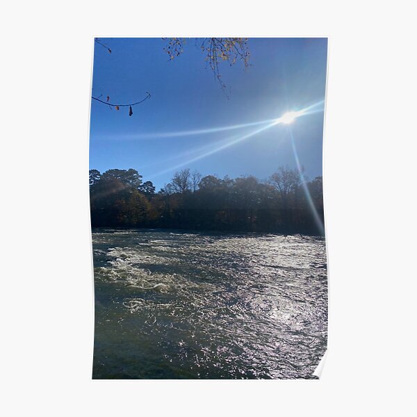 Chattahoochee river fall picture with brilliant sunlight and fall foliage on a sticker, mug, and print.  Poster