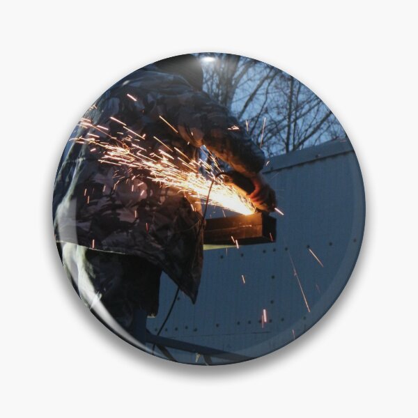 Item preview, worker cuts metal, sheaf of bright sparks scatter in the twilight  designed and sold by mrivserg.