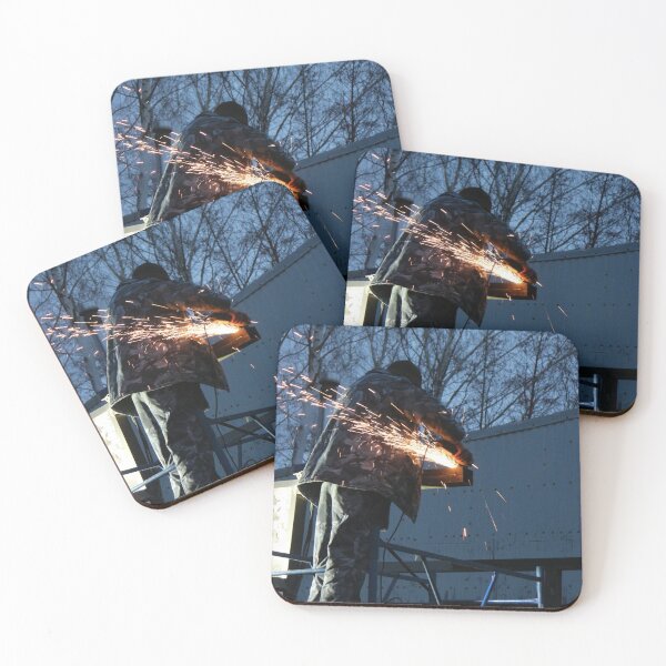 Item preview, worker cuts metal, sheaf of bright sparks scatter in the twilight  designed and sold by mrivserg.