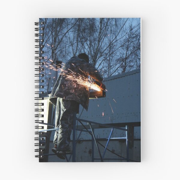 Item preview, worker cuts metal, sheaf of bright sparks scatter in the twilight  designed and sold by mrivserg.