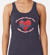 Cute enough to stop your heart, skilled enough to restart it Racerback Tank Top